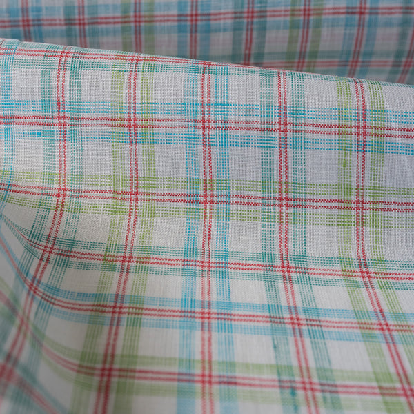Colorful Carnival Check Linen Fabric featuring a mix of aqua, green, and red threads on white, suitable for a variety of light and airy garments.