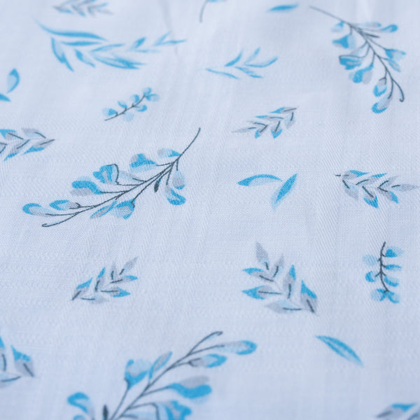 Lightweight-medium weight Blue Botanical Breeze linen fabric with subtle plaid weave and blue floral prints