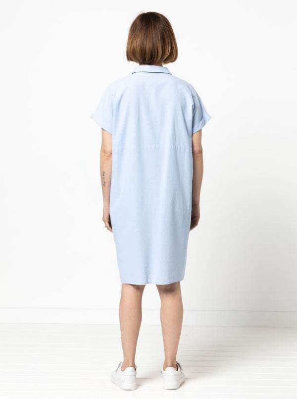 Lady wearing a blue dress made with the Blaire Dress Sewing Pattern – Shirtmaker style with shirt tail and inset pockets.