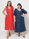 Two women wearing red and blue dresses made using a style arc Esther woven dress sewing pattern posing against a white background