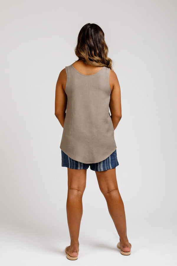 Megan Nielsen’s Eucalypt pattern featuring a relaxed-fit woven tank top and dress with scoop neckline and curved hemline, suitable for light to medium weight fabrics.