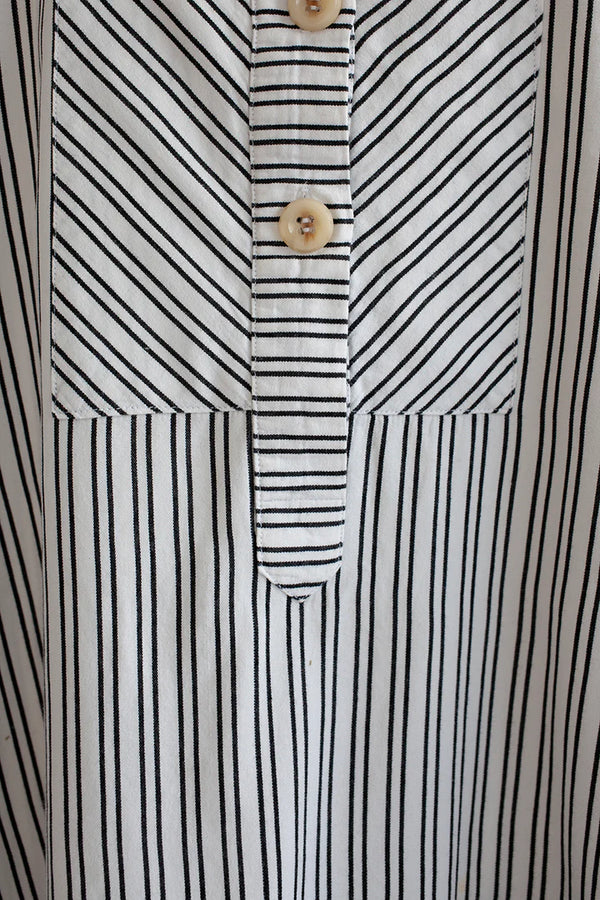 Customizable French Smock sewing pattern with options for button or zip fastening, various bib shapes, and optional trims, perfect for creating a unique garment.