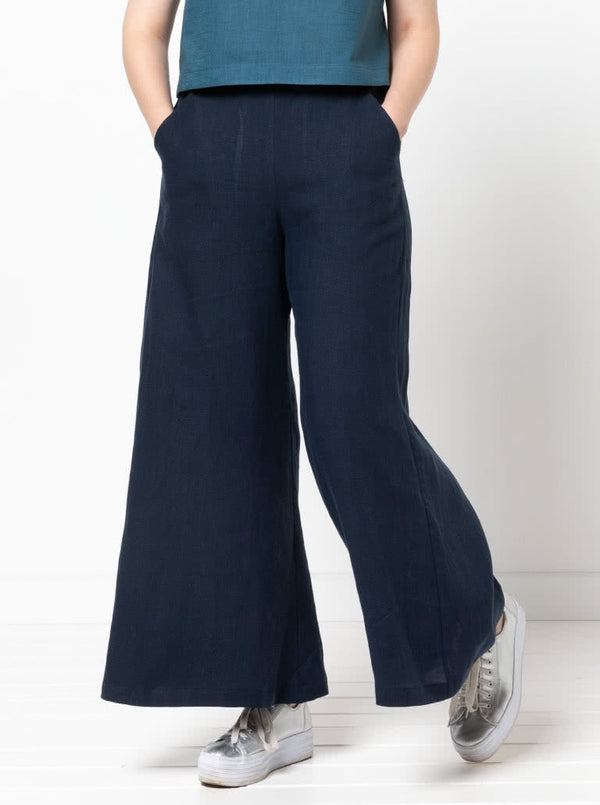 Loddon Woven Pant sewing pattern, featuring wide-leg, full-length pants with elastic waist, flat front waistband, and angled pockets, suitable for washed linen, crepe, viscose, or fine wool fabrics.