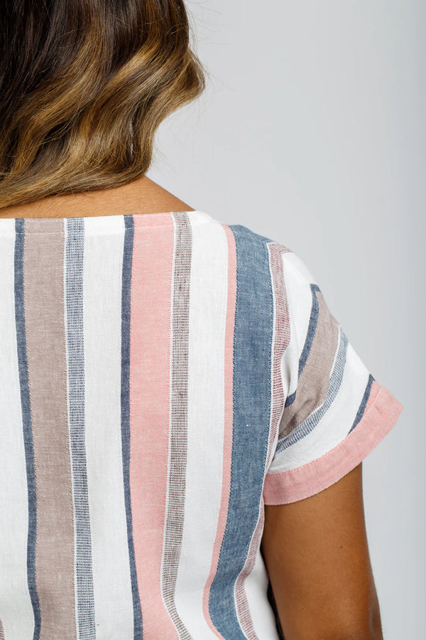 A relaxed silhouette Olive dress and top sewing pattern with a v-insert, drop shoulder, and multiple sleeve options, perfect for creating versatile garments.