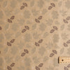 Nature-inspired Sand & Leaves linen fabric with a soft grip and leaf prints, perfect for creating stylish summer garments.