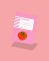Pin with tomato design on pink card with 'SOHMO' branding against a pink background