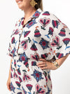 Albie Woven Shirt Multi-Size Sewing Pattern - PrintedAlbie Shirt Sewing Pattern with front, back, and side views, showcasing a box-shaped body, dropped shoulder, and square-shaped elbow-length sleeves with wide hems.