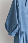 Blue malie Wrap Dress made with PDF sewing pattern dress with puffed sleeves on a plain background