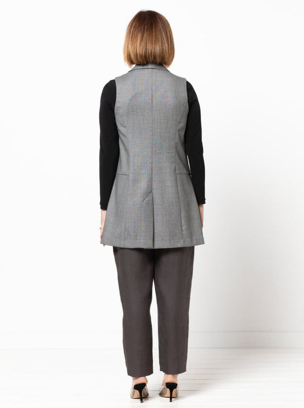 Andrea Woven Vest sewing pattern, featuring a long line vest with a shawl collar, sleeveless design, and optional pockets for a sleek and stylish garment.