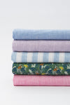 Variety of Linen Fabrics Rolled onto Bolts - de Linum Australia