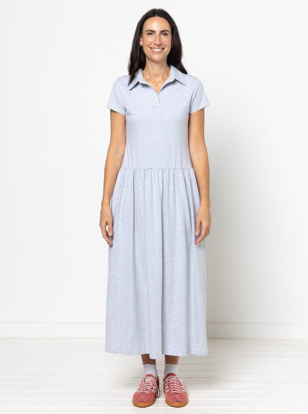 Woman wearing a light blue Carter Dress made using StyleArc patternwith a white background