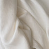 Close-up ofChalk White extra wide 280cm 100% linen fabric 300gsm for jackets, aprons, cushions, curtains and structured home textiles with soft folds