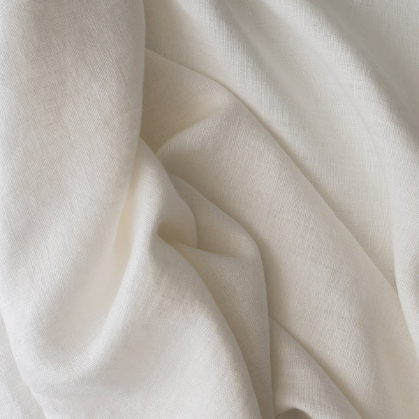 Close-up ofChalk White extra wide 280cm 100% linen fabric 300gsm for jackets, aprons, cushions, curtains and structured home textiles with soft folds