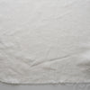 Close-up ofChalk White extra wide 280cm 100% linen fabric 300gsm for jackets, aprons, cushions, curtains and structured home textiles on a plain background