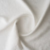 Close-up of Chalk White extra wide 280cm 100% linen fabric 300gsm for jackets, aprons, cushions, curtains and structured home textiles with soft folds