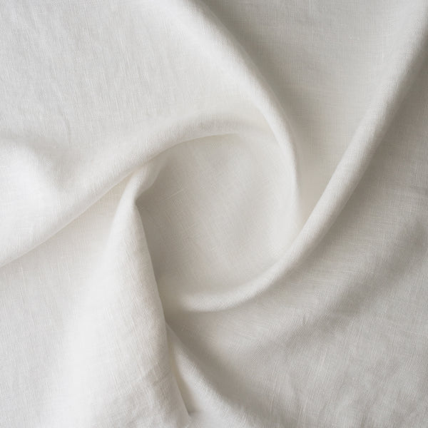 Close-up of Chalk White extra wide 280cm 100% linen fabric 300gsm for jackets, aprons, cushions, curtains and structured home textiles with soft folds