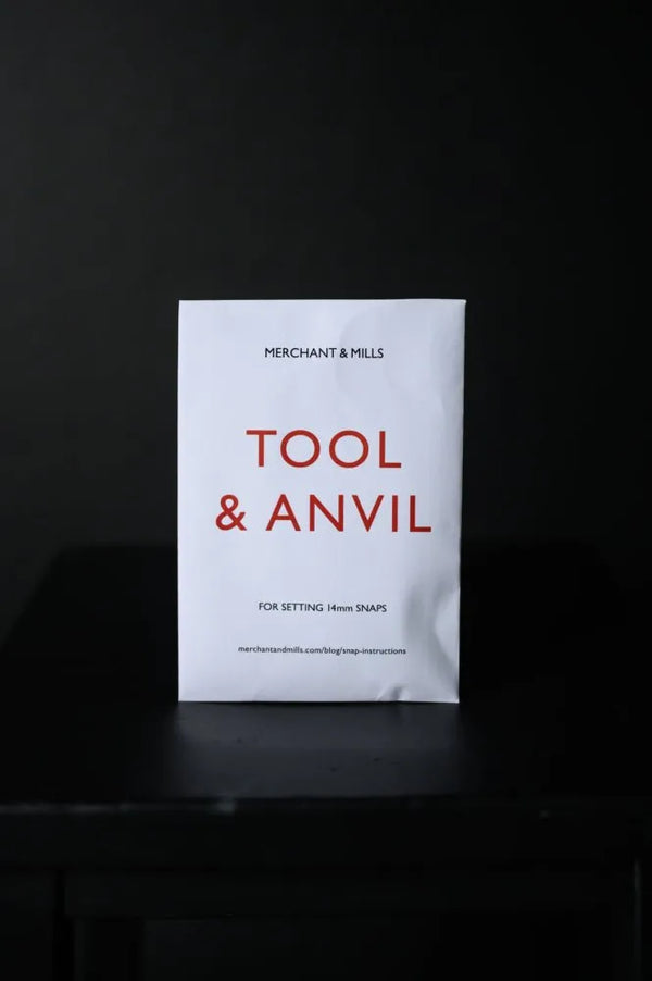 White packet with 'Tool & Anvil' text on a black background