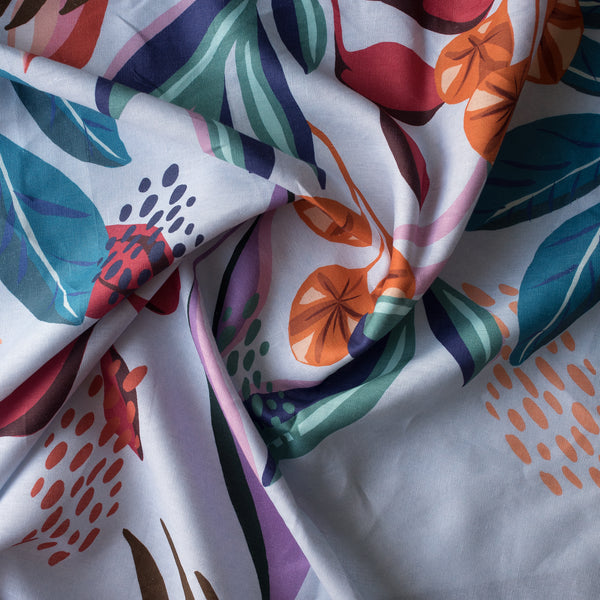 Colorful fabric with abstract leaf patterns on a white background
