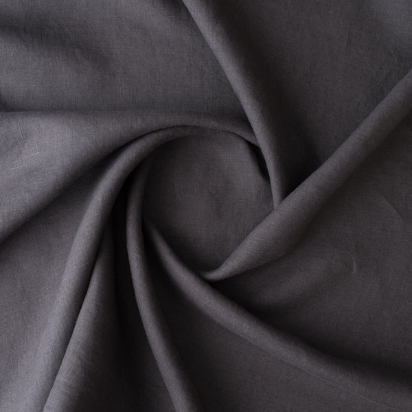 Close-up of dark gray fabric with folds