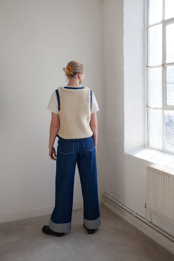 rear side of lady wareing Waistcoat made using Devon Waistcoat Sewing Pattern PDF – Relaxed fit, fully lined, reversible design with patch pockets and button or snap closures.