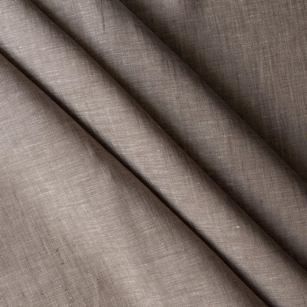 Close-up of Earthbound Chambray Linen fabric in a warm taupe stone shade, 100% linen, 145 GSM with chambray texture — close-up weave detail