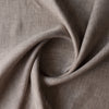 Close-up of Earthbound Chambray Linen fabric in a warm taupe stone shade, 100% linen, 145 GSM with chambray texture — close-up weave detail
