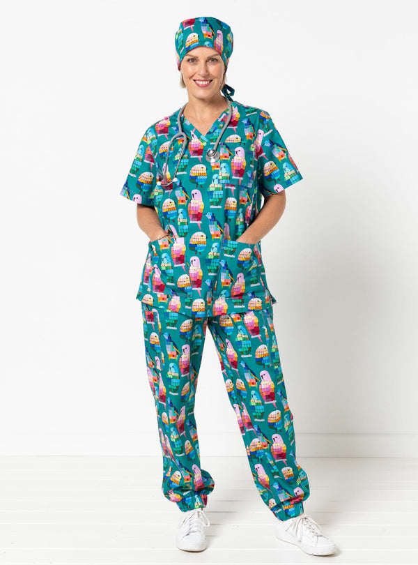 Person wearing a colorful scrub set with ice cream pattern on a white background