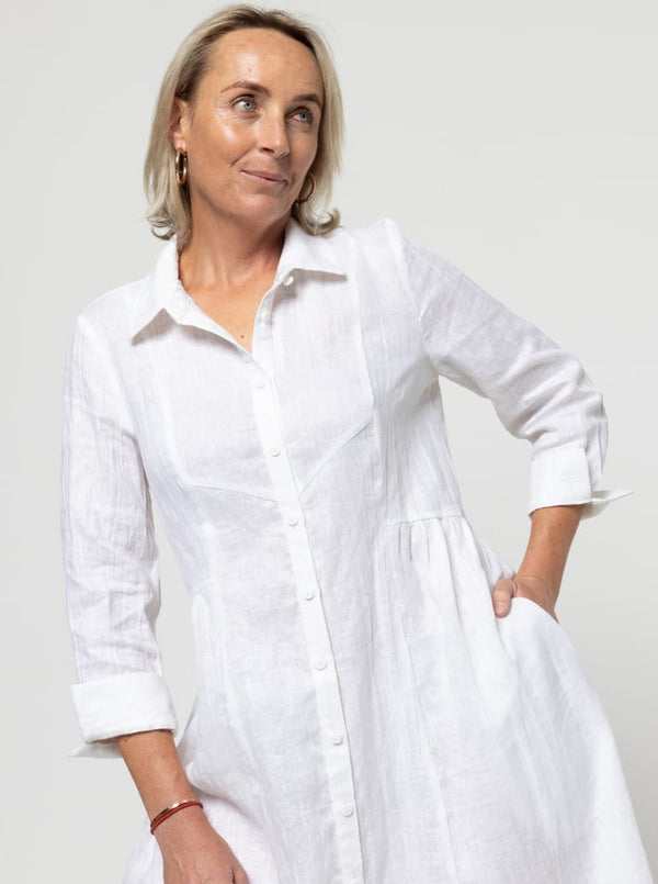 Hampton Woven Dress Sewing Pattern – Mid-calf shirtdress with gathered skirt, curved waist, sleeve or sleeveless options, and inseam pockets.