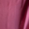 Hot pink 100% linen fabric with lightweight plain weave and smooth drape