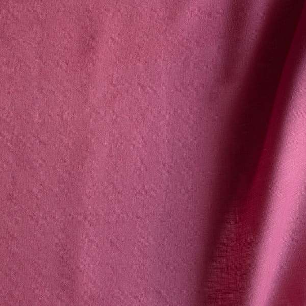 Hot pink 100% linen fabric with lightweight plain weave and smooth drape