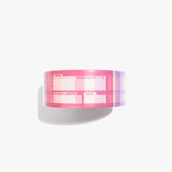 Pink and white checkered tape roll on a white background