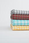 Elegant Multi-Check Linen Fabrics on White Backdrop - de Linum Australia