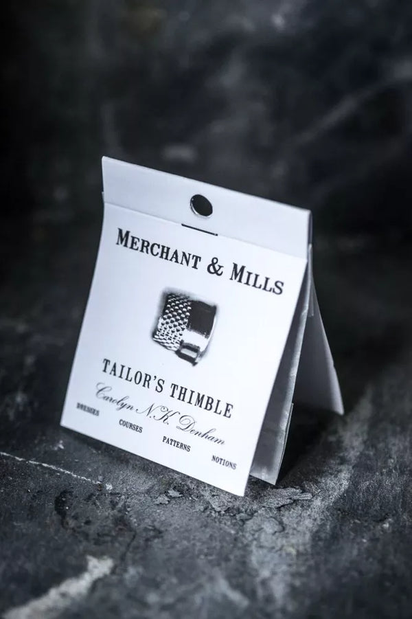 Merchant & Mills Tailor's Thimble packaging on a dark textured surface