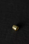 Gold thimble on a black background
