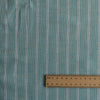 Mint Shore Stripe linen fabric with aqua–mint base, white vertical stripes and a subtle wave-like textured weave, 160 GSM