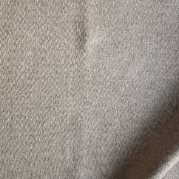 Close-up of Natural Crest Stripe — natural beige 100% linen fabric with vertical herringbone stripes, 220 GSM