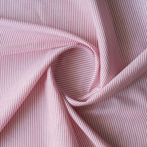 Close-up of Raspberry Pinstripe — raspberry red 100% linen fabric with white vertical pinstripes, 130 GSM, 44 LEA.
