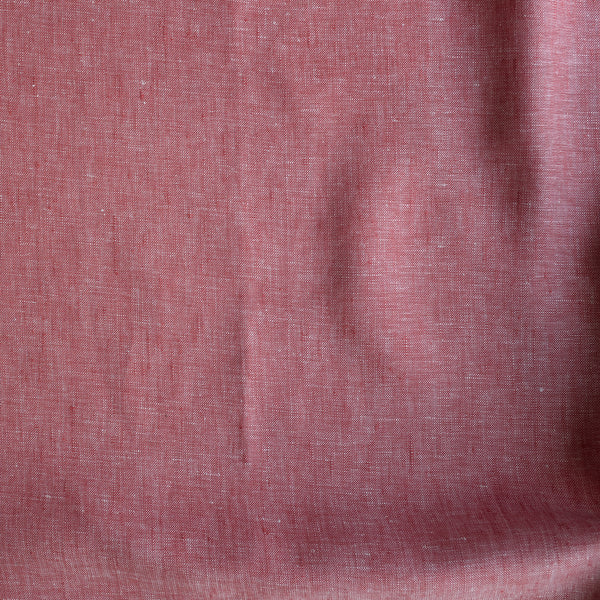 Close-up of a textured Rustic Rose textured linen fabric in earthy rose-pink, 100% linen yarn dyed, 225 GSM, 25 LEA.