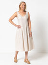A sophisticated sleeveless dress with a high-waisted fitted bodice, gored skirt, and invisible zip, made from luxurious linen fabric.