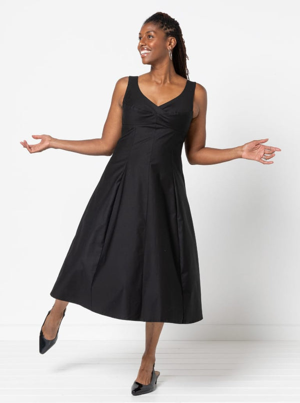 A sophisticated sleeveless dress with a high-waisted fitted bodice, gored skirt, and invisible zip, made from luxurious linen fabric.