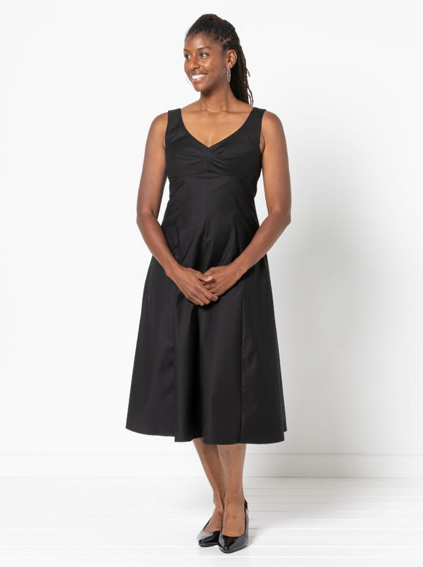 A sophisticated sleeveless dress with a high-waisted fitted bodice, gored skirt, and invisible zip, made from luxurious linen fabric.