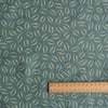 Sage Coast Print linen fabric with small botanical leaf motifs on a muted blue–green base
