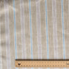Seagrass Pinstripe linen fabric with pale sage-beige base, light-brown pinstripes, white and blue accents, 100% linen, 130 GSM, 60 LEA fabric with a ruler at the bottom for scale