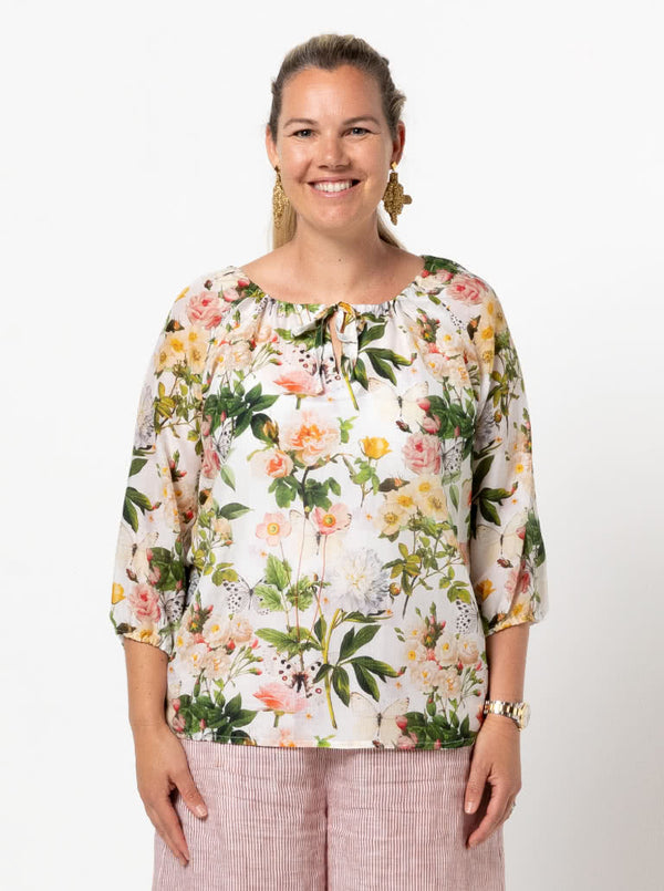 front view of Style Arc Anita Peasant Blouse Sewing Pattern with drawstring neck and raglan sleeves