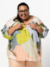front view of Style Arc Anita Peasant Blouse Sewing Pattern with drawstring neck and raglan sleeves