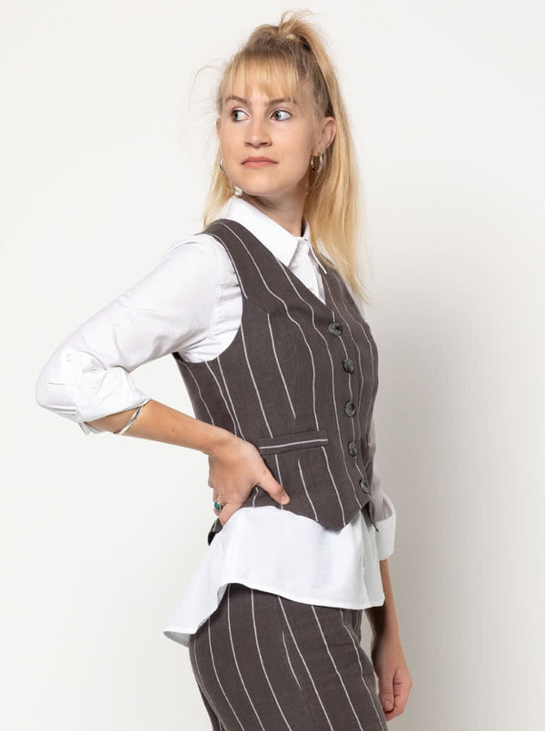 Joy Woven Vest sewing pattern featuring faux welt pockets, princess line, button opening with four buttons, cutaway at center back, easy fit, and fully lined, suitable for linen and cotton fabrics.
