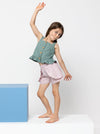 Kit Kids Tank Top sewing pattern, featuring a button-through top with frilled hem and adjustable shoulder straps for kids, suitable for linen, cotton, and denim fabrics.