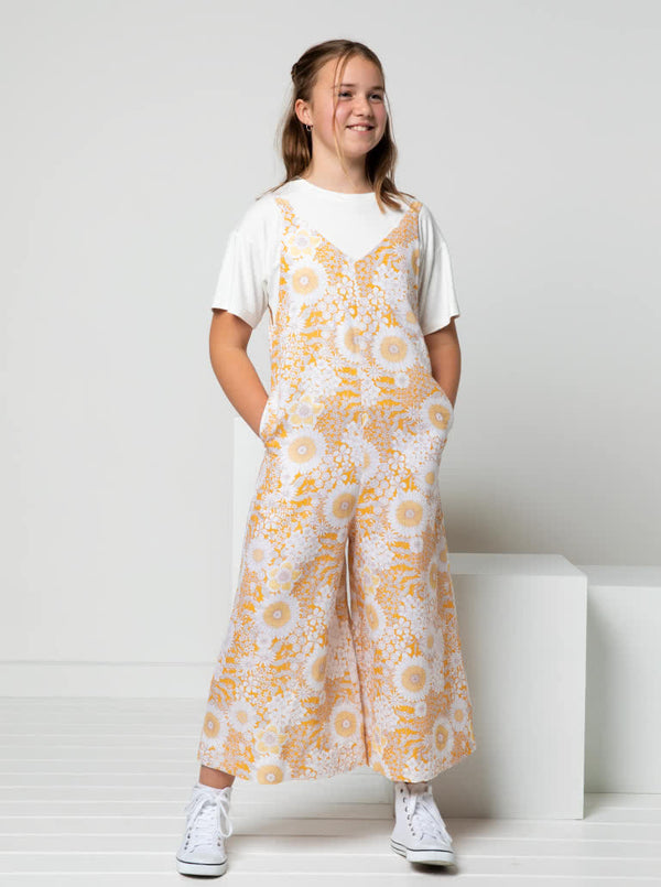 A fashionable Norman Teens jumpsuit sewing pattern with a “V” neck and wide legs, designed for comfort and style in teen sizes.