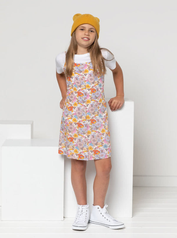 Chic Penny Teens swing dress or top sewing pattern featuring a shirred back panel, rouleau straps, and a faux button opening, designed for cotton, linen, and rayon fabrics