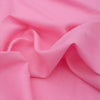 Vivid Candy Pink 100% Linen Fabric with natural texture, perfect for creating eye-catching fashion pieces and comfortable apparel.